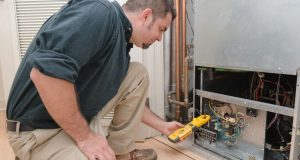 HVAC Tech working on a furnace